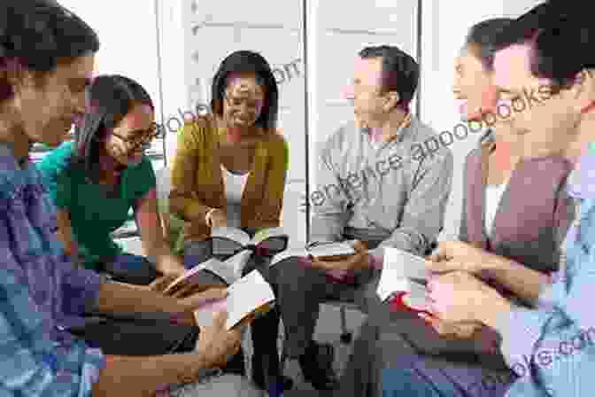 A Group Of Young Black Males Smiling And Laughing While Reading Books And Working Together. Motivating Black Males To Achieve In School And In Life