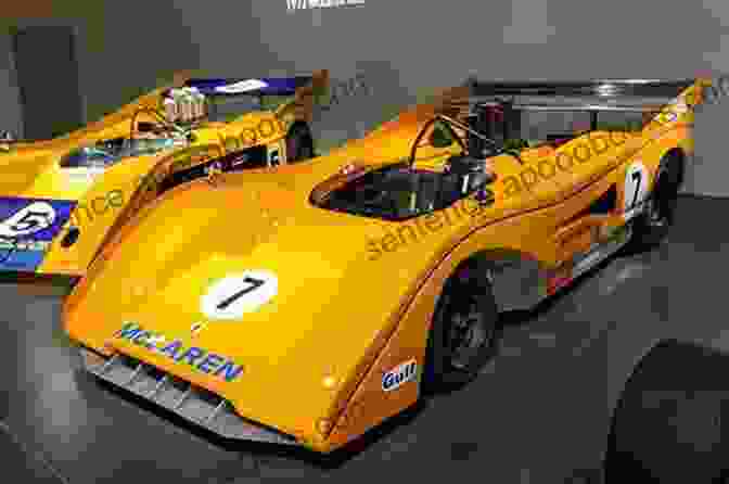 McLaren Formula One Car With Classic Papaya Livery Focus On: 20 Most Popular Formula One Entrants: Bugatti McLaren Scuderia Ferrari Williams Grand Prix Engineering Lancia Brabham Talbot Cooper Car US F1 Team Modena (racing Team) Etc